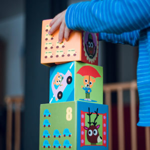 child-stacking-colorful-blocks