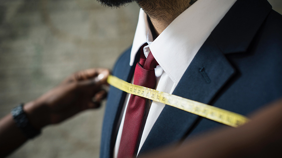man-being-measured-for-a-custom-suit